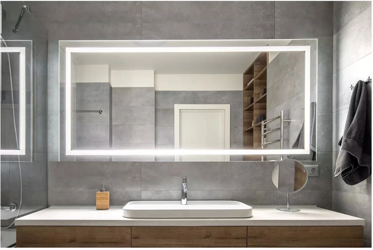A stylish gold accents bathroom with best custom lighted mirror and a sink in Adelaide.