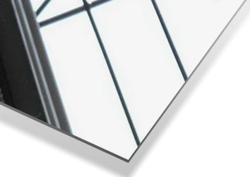 Brushed stainless steel mount stand for a mirror.