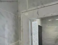 Thumbnail of a frosted-edge LED mirror that fills the space with a gentle glow above a single sink.